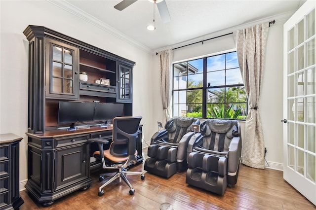 office featuring a ceiling fan, crown molding, wood finished floors, and baseboards