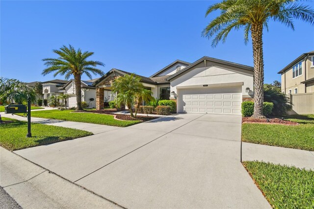 8307 Bluevine Sky Dr, Land O Lakes, FL 34637 - ranch-style house featuring a garage, stucco siding, driveway, a front yard, and a residential view