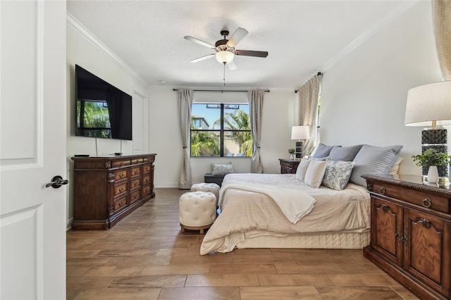 8307 Bluevine Sky Dr, Land O Lakes, FL 34637 - bedroom featuring crown molding, wood finished floors, baseboards, and a ceiling fan