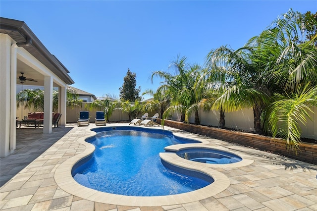 8307 Bluevine Sky Dr, Land O Lakes, FL 34637 - view of swimming pool with a fenced backyard, a patio area, ceiling fan, and a pool with connected hot tub