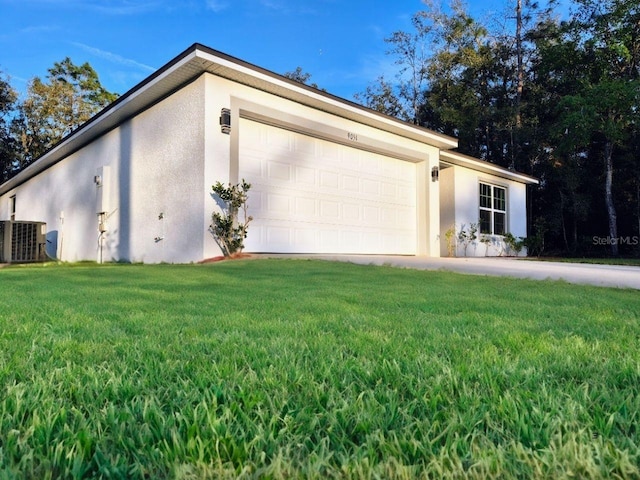 garage featuring concrete driveway and central AC