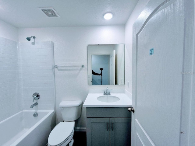 full bathroom with washtub / shower combination, visible vents, toilet, and vanity