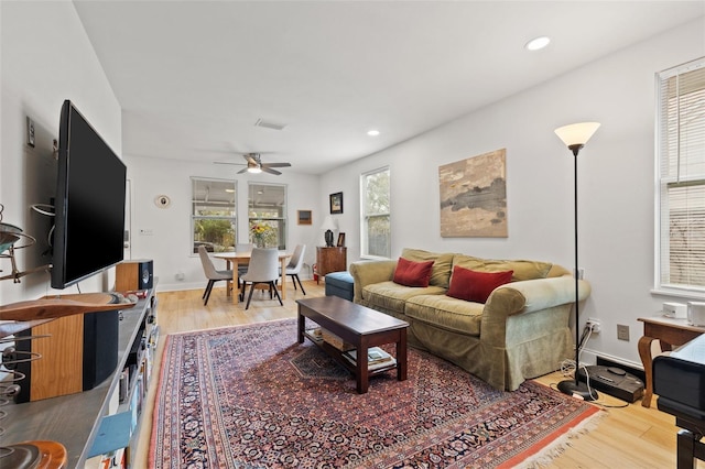 living room with recessed lighting, wood finished floors, and ceiling fan