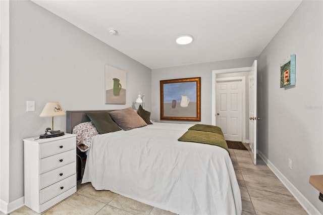 bedroom featuring baseboards