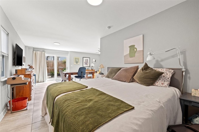 bedroom featuring access to outside and light tile patterned flooring