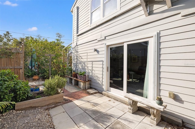 view of patio / terrace featuring fence