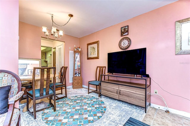 interior space with a chandelier and baseboards