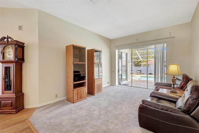 living area featuring visible vents and baseboards