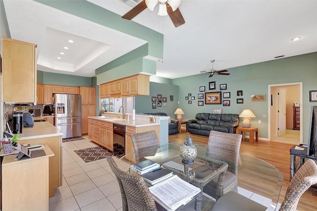 dining room featuring visible vents, a ceiling fan, recessed lighting, light tile patterned floors, and a raised ceiling