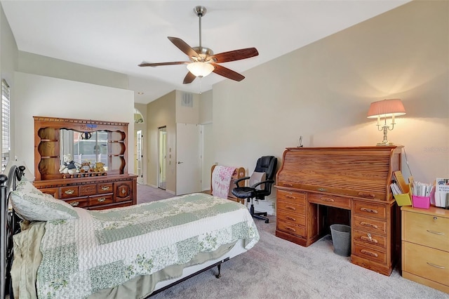 bedroom featuring a ceiling fan, visible vents, and light carpet