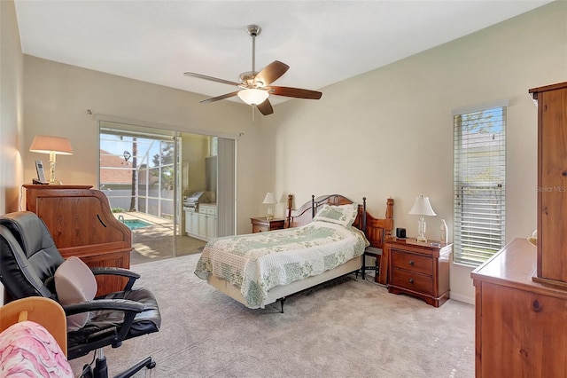 bedroom with light carpet, access to exterior, and a ceiling fan