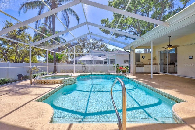 view of swimming pool featuring fence, glass enclosure, a patio, area for grilling, and a ceiling fan