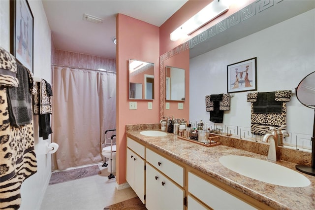 full bath with double vanity, toilet, visible vents, and a sink