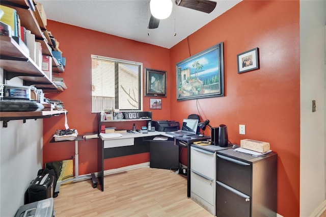 office with a ceiling fan and light wood-type flooring