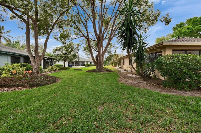 view of yard featuring a garage