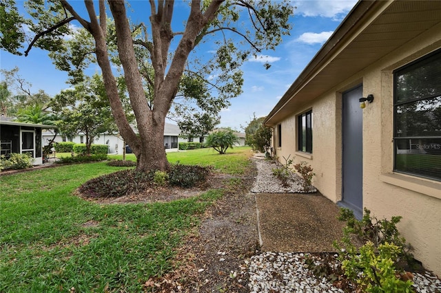 view of yard featuring a sunroom