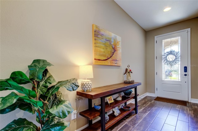 entryway with recessed lighting, baseboards, and dark wood-style flooring