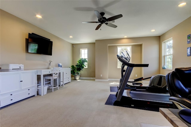 exercise area featuring light colored carpet, recessed lighting, baseboards, and ceiling fan