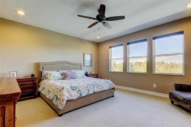 bedroom featuring recessed lighting, baseboards, light colored carpet, and ceiling fan