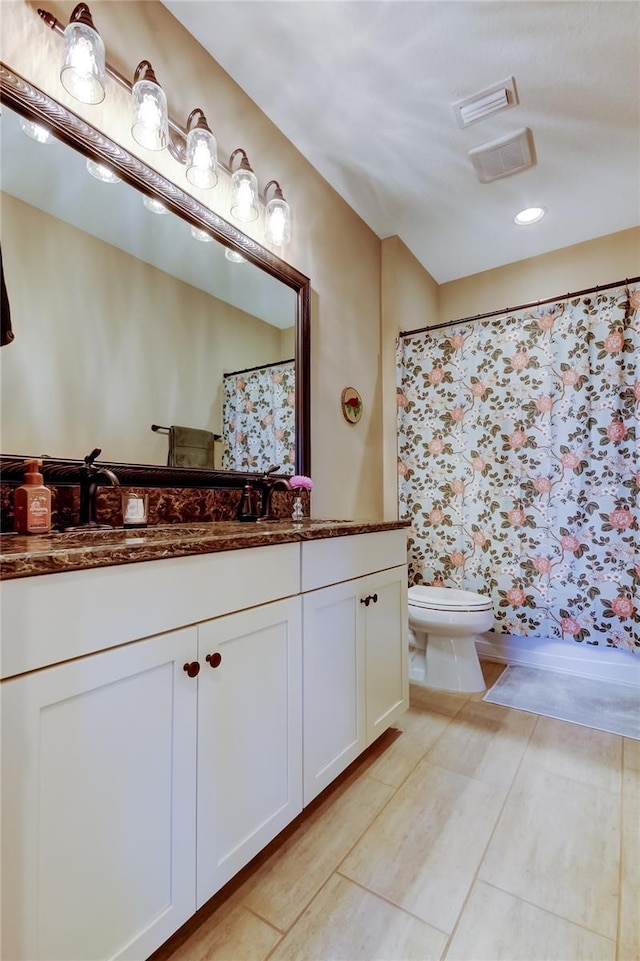 full bath with tile patterned flooring, toilet, vanity, and a shower with curtain