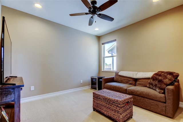 living room featuring recessed lighting, baseboards, light carpet, and a ceiling fan