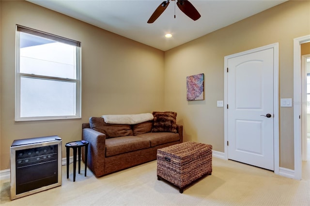 living area featuring recessed lighting, baseboards, light colored carpet, and ceiling fan