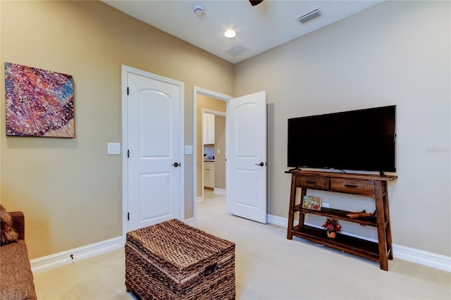 interior space featuring light colored carpet and baseboards