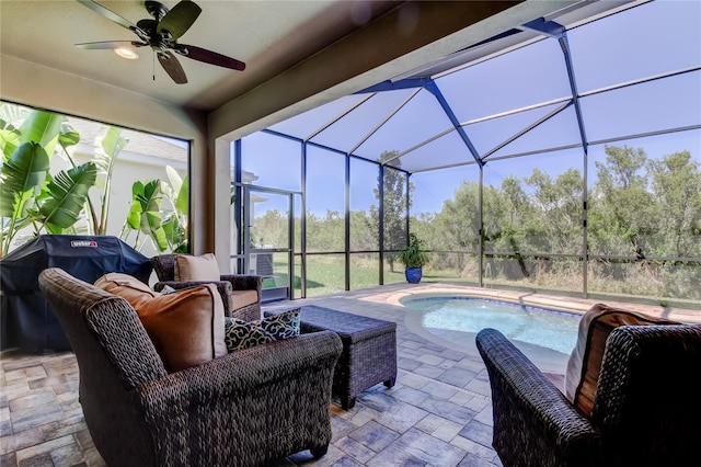 view of patio featuring an outdoor living space, glass enclosure, an outdoor pool, and ceiling fan