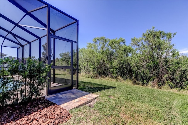 view of yard featuring glass enclosure