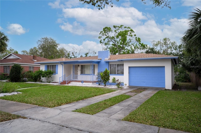 ranch-style house featuring driveway, an attached garage, a chimney, stucco siding, and a front lawn