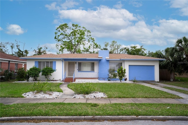 ranch-style house featuring a front yard, concrete driveway, a garage, and stucco siding