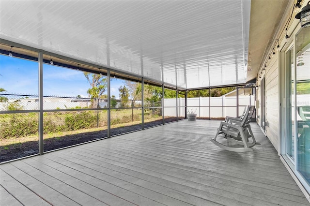 unfurnished sunroom with plenty of natural light