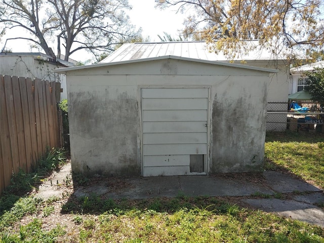 view of shed with fence