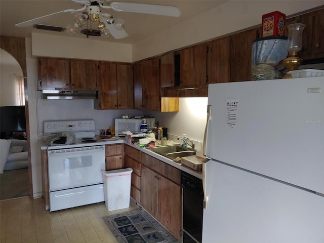 kitchen featuring under cabinet range hood, light countertops, white appliances, a ceiling fan, and a sink