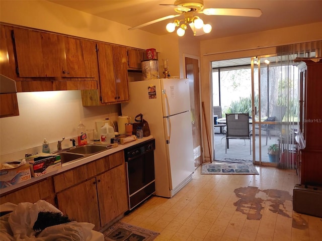 kitchen featuring brown cabinets, light wood-style flooring, a sink, light countertops, and dishwasher