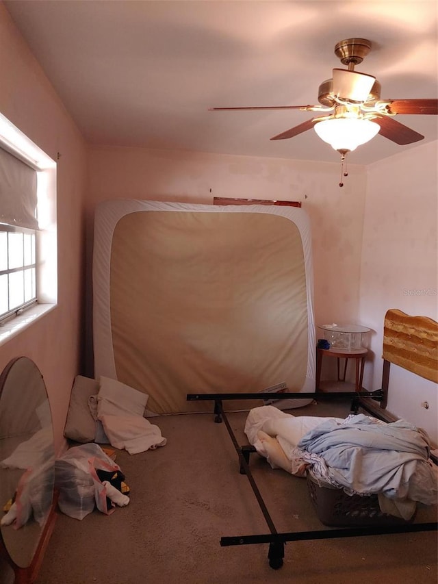 bedroom with carpet and a ceiling fan