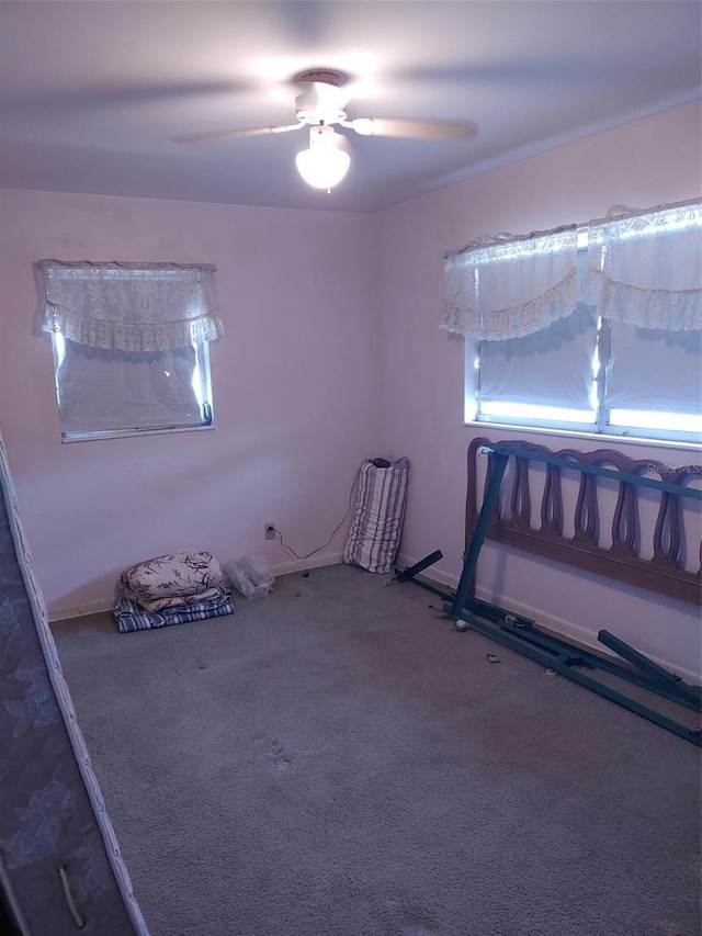 unfurnished bedroom with carpet and ceiling fan