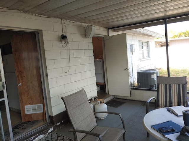 view of patio featuring central air condition unit, washer / clothes dryer, and visible vents