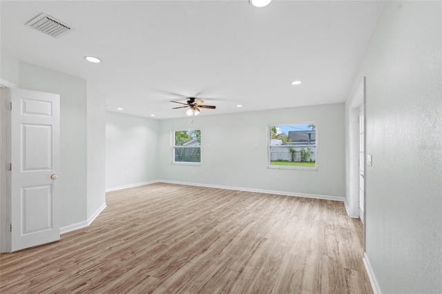 unfurnished room featuring recessed lighting, visible vents, baseboards, and light wood-style floors