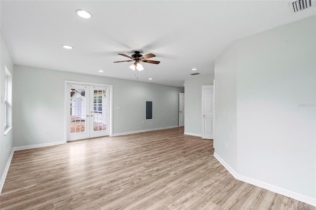 unfurnished living room with visible vents, recessed lighting, french doors, light wood finished floors, and baseboards