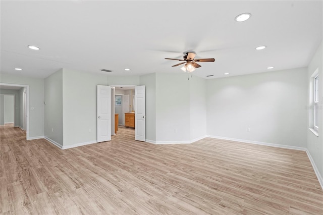 spare room with recessed lighting, baseboards, visible vents, and light wood finished floors