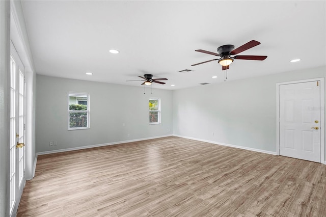 empty room with baseboards, visible vents, recessed lighting, ceiling fan, and light wood-type flooring