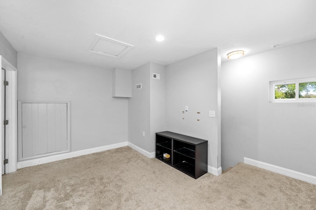 below grade area with baseboards, visible vents, recessed lighting, and carpet