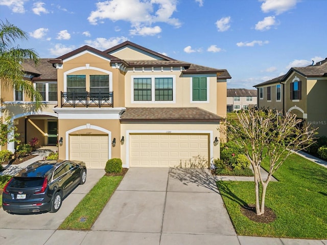 view of front of house with stucco siding, concrete driveway, a shingled roof, a garage, and a balcony