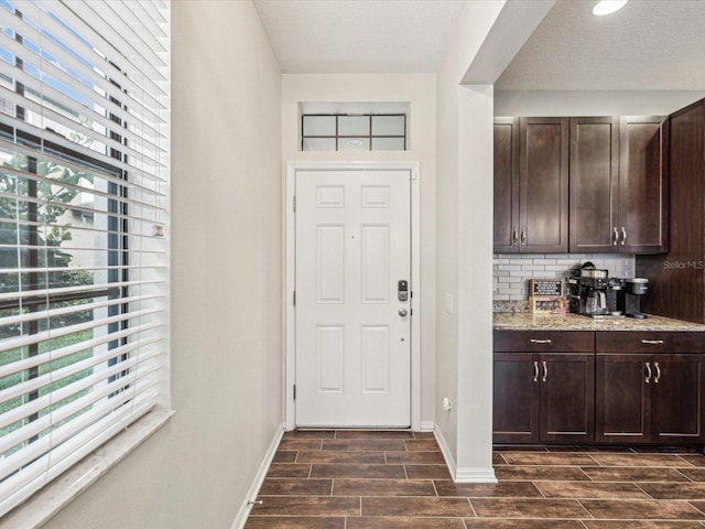 interior space featuring wood finish floors and baseboards