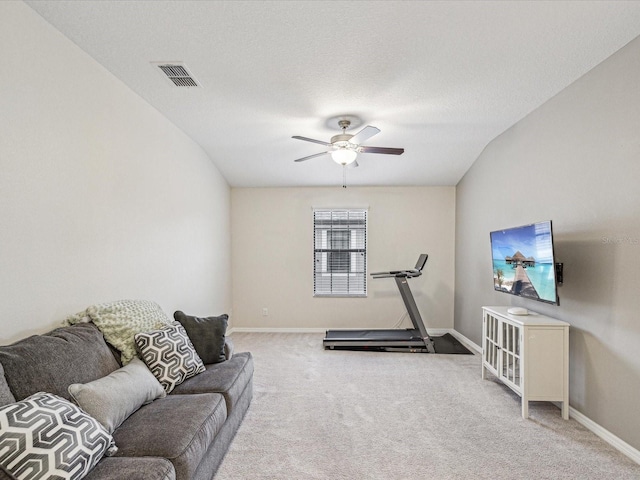 workout area with visible vents, baseboards, ceiling fan, and carpet floors