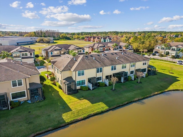 bird's eye view featuring a residential view and a water view