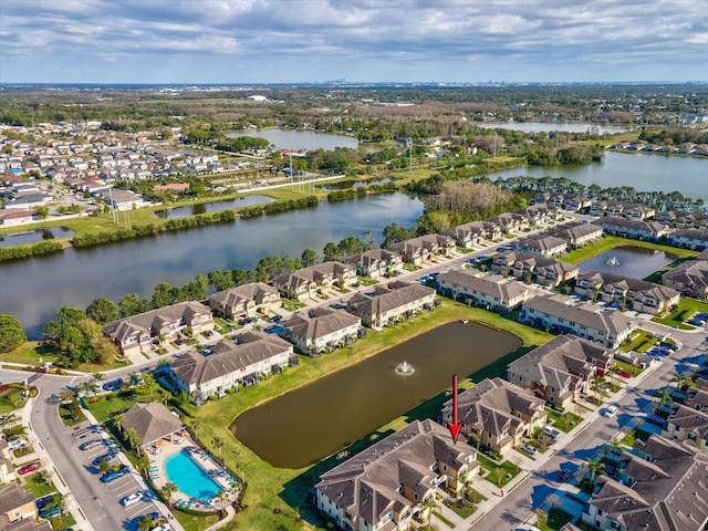 birds eye view of property featuring a residential view and a water view