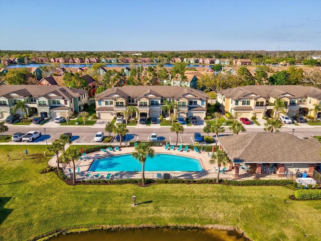 bird's eye view with a residential view and a water view