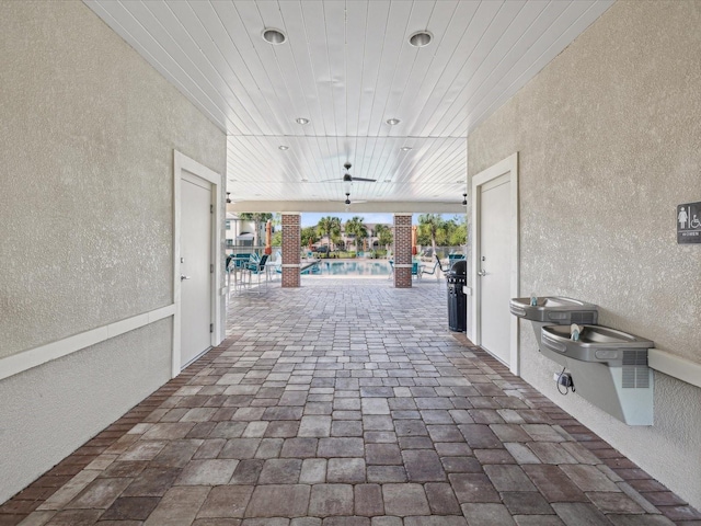 view of patio / terrace featuring an outdoor pool and ceiling fan